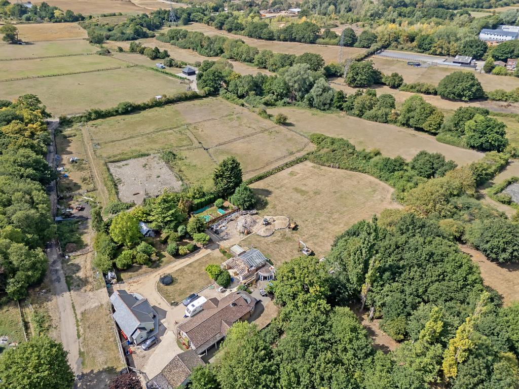 Lot: 72 - VACANT LAND IN VILLAGE LOCATION - Aerial drone shot of the land
